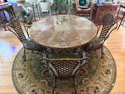 Round Iron & Wood Table w/ 4 Chairs. Excellent condition. Table stands 30 inches tall with a 