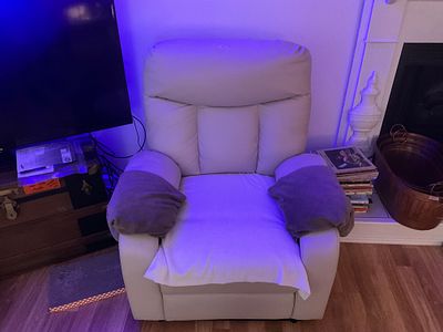 Faux Leather Electric Recliner. Good working condition. Damage to one arm rest. See photos.