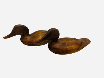Pair Carved Wooden Ducks Signed On Bottom. Each measures 7 1/2 inches long.