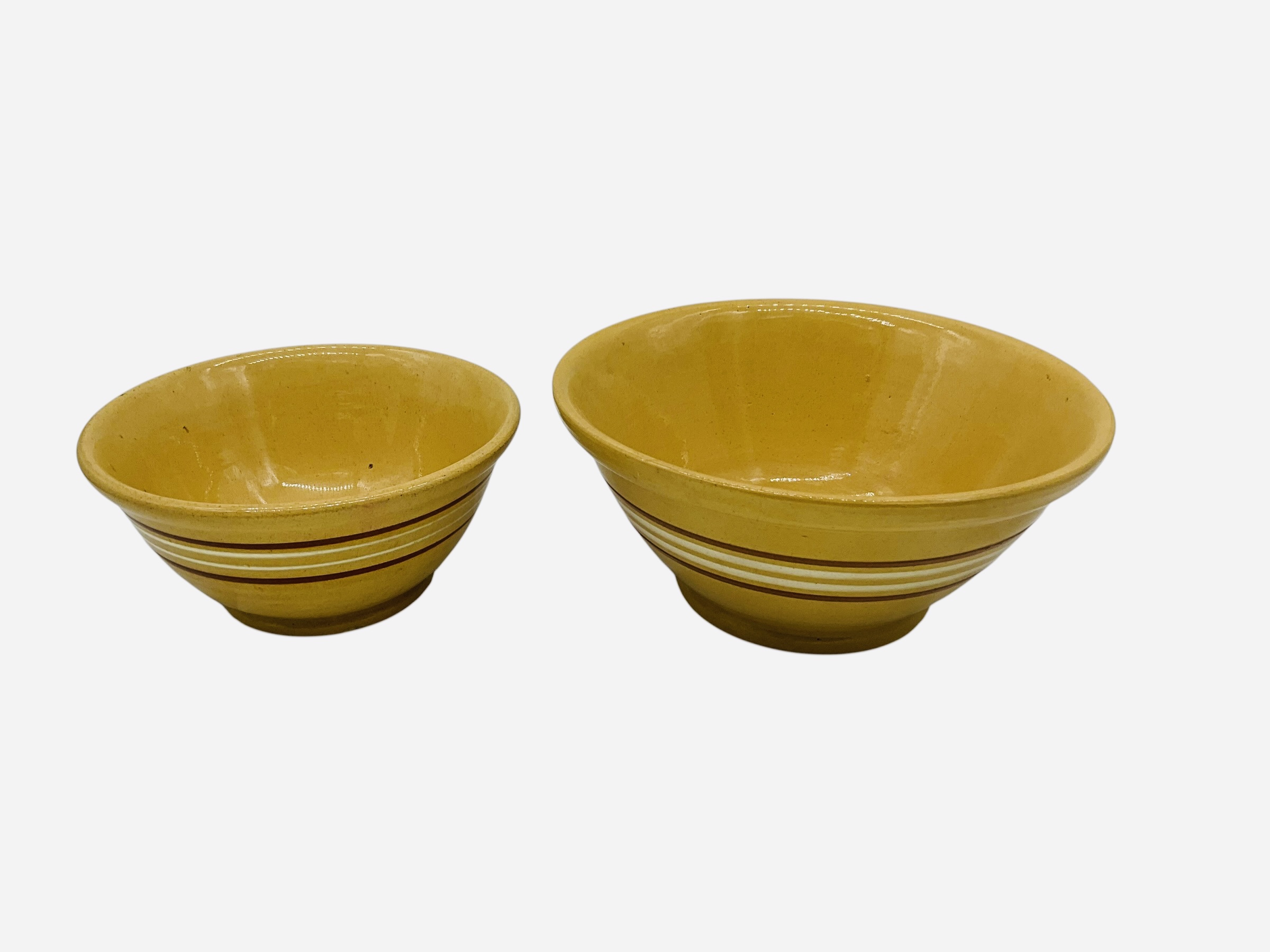 Two Graduated Yellow Ware Bowls