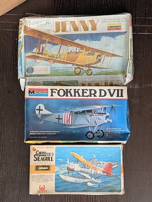 Trio of New Old Stock Vintage Plastic Model Bi-Plane Kits by Lindberg, Monogram, and Hasegawa