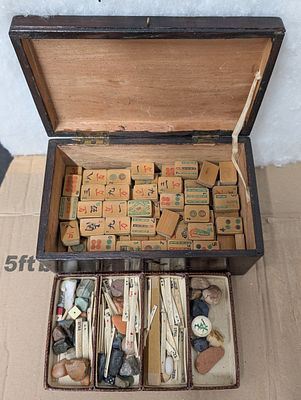 An early 20th-century Chinese Bone and Bamboo Mahjong set in a wooden case