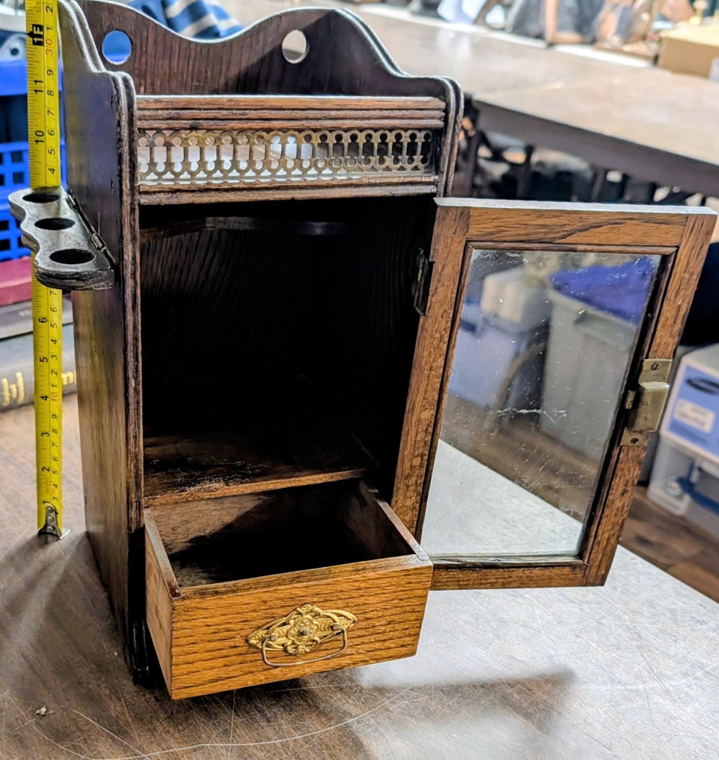 Antique dark oak smoker's cabinet with Hinged side-mounted pipe racks and brass