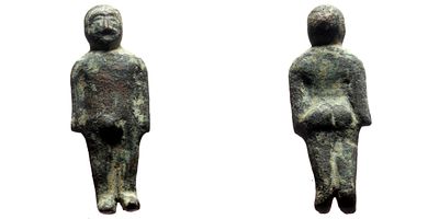 Bronze Roman figurine of a male. AE (16.85g, 40x16mm) figurine of a male with his hands next to 