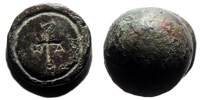 Round bronze seal with a ball-shaped handle depicting a cross monogram. AE (59.36g, ca. 40x20mm) 