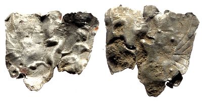 Silver application decorated with an embossed ornament depicting a rider galloping on a horse. AR 