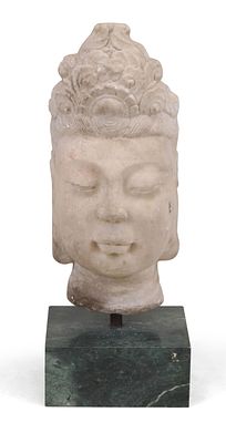 Chinese Carved White Stone Buddha Head. Chinese Carved White Stone Buddha Head On green marble 
