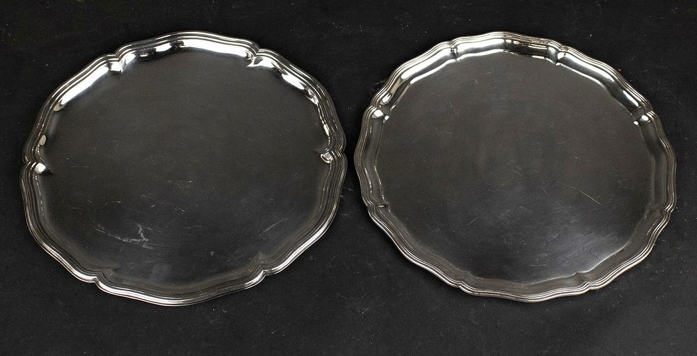 Two Circular Silver Trays. Two Circular Silver Trays Both in the Chippendale style. One in 