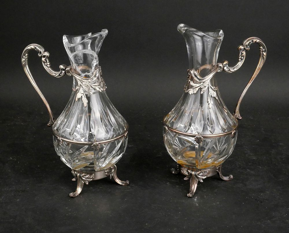 Pair of Silver Plated and Glass Pitchers. Pair of Silver Plated and Glass Pitchers Losses 
10 