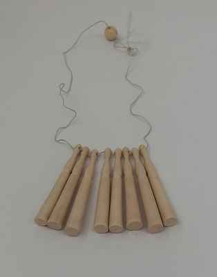 Подвеска. Конец XIXв. - начало ХХв. Костная мука. Длина: 6см. У одной есть скол.