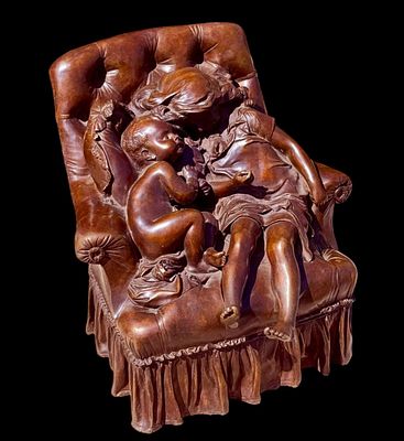 Bronze sculpture is titled "Le Nid" (The Nest), created by French artist Aristide-Onesime Croisy. 