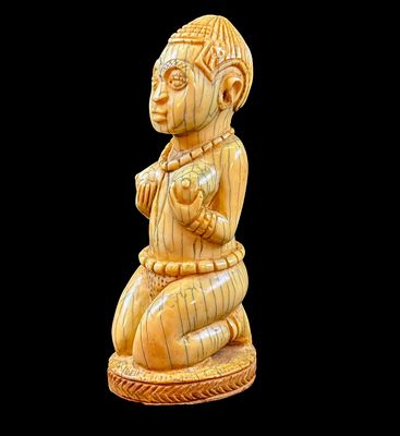 Rare Benin carved sculpture, kneeling female 19th c. Rare Benin carved sculpture. Figure of 