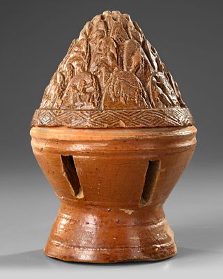 A CHINESE BROWN GLAZED BURNER, EASTERN HAN DYNASTY (25-220 AD). A brown glazed burner and cover 