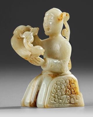 A CHINESE CARVED JADE FIGURE, 20TH CENTURY. A Chinese jade carving features a finely detailed 
