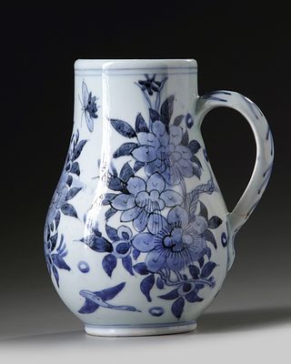 A JAPANESE ARITA BLUE AND WHITE JUG, 17TH CENTURY. Height 19 cm. PROVENANCE From a private 