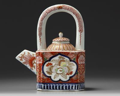 A JAPANESE IMARI-ARCH-HANDLES TEAPOT AND COVER, 19TH CENTURY. An Imari arch-handled teapot with 