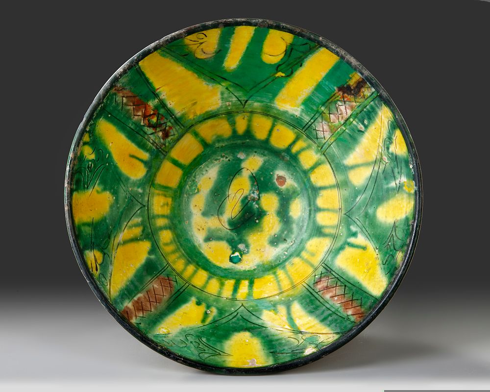 A NISHAPUR TANG SPLASHED BOWL, PERSIA, 10TH-11TH CENTURY. A nishapur pottery bowl with small 