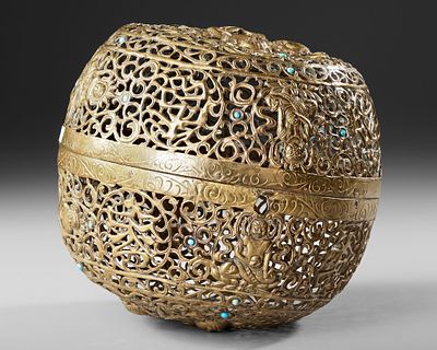 HANGING TIBETAN BRASS INCENSE BURNER, 19TH CENTURY. The burner decorated with the Tibetan 