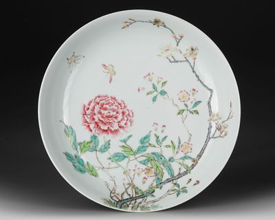 A CHINESE FAMILLE ROSE 'FLORAL DISH, 19TH CENTURY. A famille rose porcelain dish delicately 