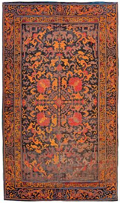 A RARE CHINESE CARPET WITH DRAGONS AND LOTUS, LATE MING DYNASTY. Silk velvet, patterned in 