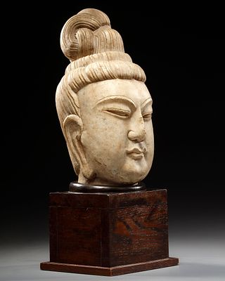 A GRAY STONE HEAD OF A BODHISATTVA, CHINA, SONG DYNASTY OR LATER. The full face well-carved with 
