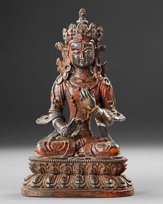 CHINESE BRONZE FIGURE – 19TH CENTURY. A finely cast Chinese bronze figure depicting a seated 