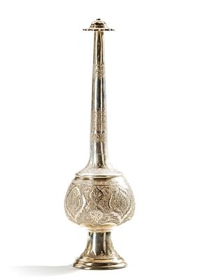 A PERSIAN SILVER ROSE WATER SPRINKLER, 19TH CENTURY. Finely engraved with intricate floral and 
