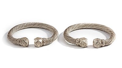 A PAIR OF SILVER BRACELETS, OMAN, 19TH CENTURY. A pair of heavy Omani silver bracelets featuring 
