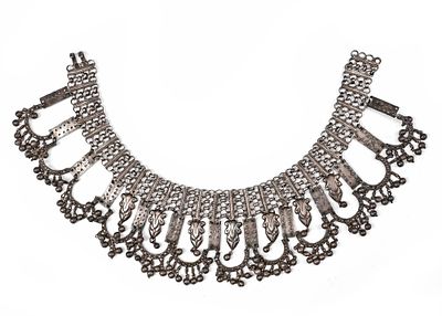 AN AFGHAN SILVER NECKLACE, 19TH CENTURY. Silver necklace featuring intricate openwork links and 