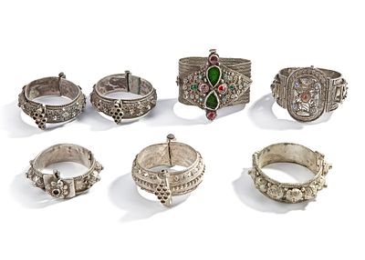 SILVER BRACELETS FROM THE ARAB WORLD, 19TH CENTURY. A collection of seven ornate silver 
