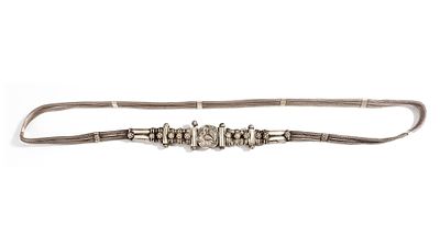 AN AFGHAN SILVER NECKLACE, 20TH CENTURY. Featuring multiple woven silver strands joined by a 