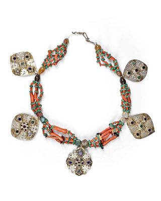 SILVER NECKLACE, MOROCCO,19TH CENTURY. Adorned with coral, green and amber beads, and ornate 