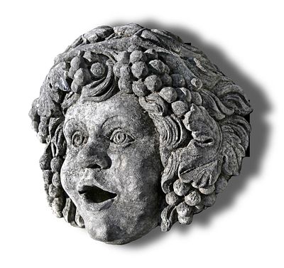 A CARVED LIMESTONE WALL FOUNTAIN MASK SECOND HALF 20TH CENTURY. In the form of a Bacchic child. 