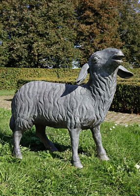 A BRONZE MODEL OF A LAMB, 20TH CENTURY. Height 75 cm. Length 90 cm.