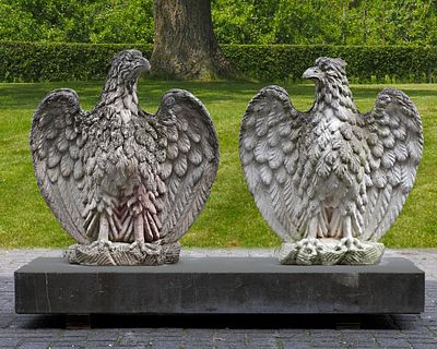 A PAIR OF COMPOSITION EAGLES, LATE 20TH CENTURY. An eagle next to a gate or at the entrance of a 