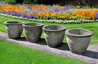 A SET OF FOUR COMPOSITION STONE GARDEN PLANTERS, SECOND HALF 20TH CENTURY. Each of ovoid form 
