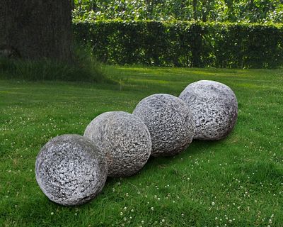 A GROUP OF FOUR STONE ORNAMENTAL SPHERES, LATE 18TH CENTURY. Probably lawn markers, diameter 30 