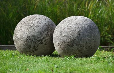 A LARGE PAIR OF LIMESTONE ORNAMENTAL SPHERES, LATE 20TH CENTURY. Probably lawn markers. Each 