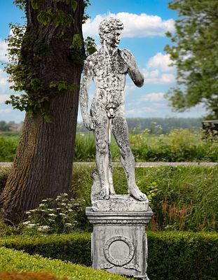A COMPOSITION STONE FIGURE OF DAVID, 20TH CENTURY. After the antique of Michelangelo, as he is 