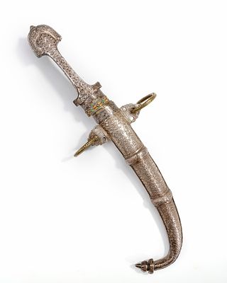 A SILVER DAGGER, MOROCCO, 19TH CENTURY. A finely crafted Moroccan dagger with a richly engraved 