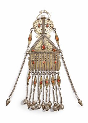 A SILVER PENDANT, TURKMENISTAN, 19TH CENTURY. Decorated with engraved patterns, gilded details 