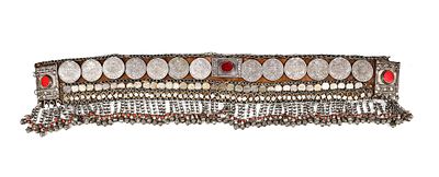 SILVER BELT – MOROCCO, 19TH CENTURY. A richly decorated Moroccan silver belt adorned with large 