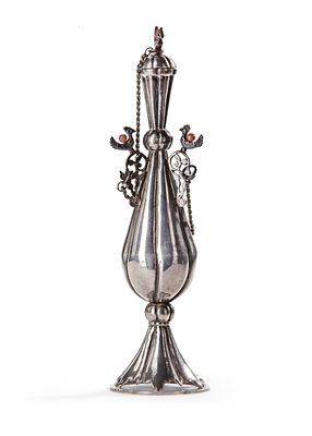 A SILVER KOHL FLASK, TUNISIA, 19TH CENTURY. Crafted with intricate details and adorned with bird 