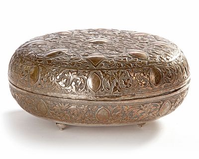 A MALAY SILVER BOX WITH COVER, 19TH CENTURY. Richly decorated in repouss&eacute; floral and geometric 