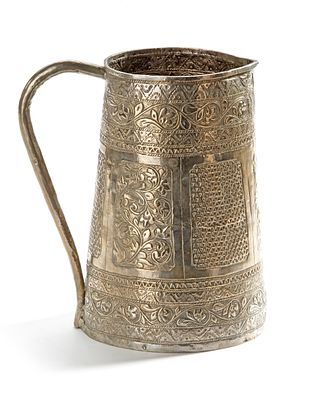 A MALAY SILVER JUG, 19TH CENTURY. Richly decorated with intricate floral and geometric 