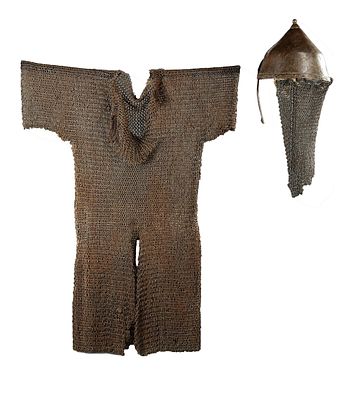 CHAINMAIL AND HELMET YEMEN, 15TH CENTURY. A rare 15th-century Yemeni chainmail shirt 