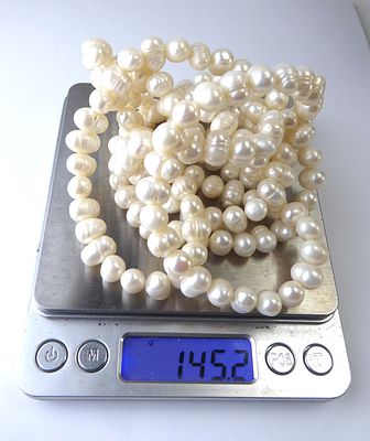 שרשרת פנינים יפיפיה 2 שורות פנינים בקוטר 1 ס"מ מושלמת אורך השרשרת 57 ס"מ משקל 145 גרם