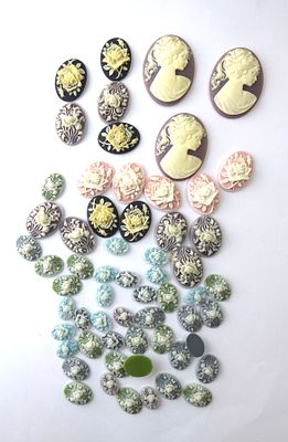 לוט גדול של יציקות קמאו מתאים לשיבוץ בתכשיטים גדלים שונים גדולים מידה 4X2.5 ס"מ קטנים מידה 1.5X1 ס"מ