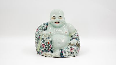 A Chinese finely Famille rose decorated porcelain figure of seated buddha. A Chinese finely 