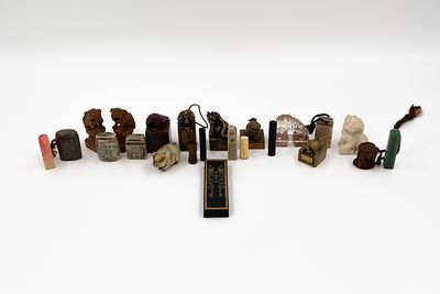 A large collection of 23 pieces various decorated figures and stamps with seal. Carved 